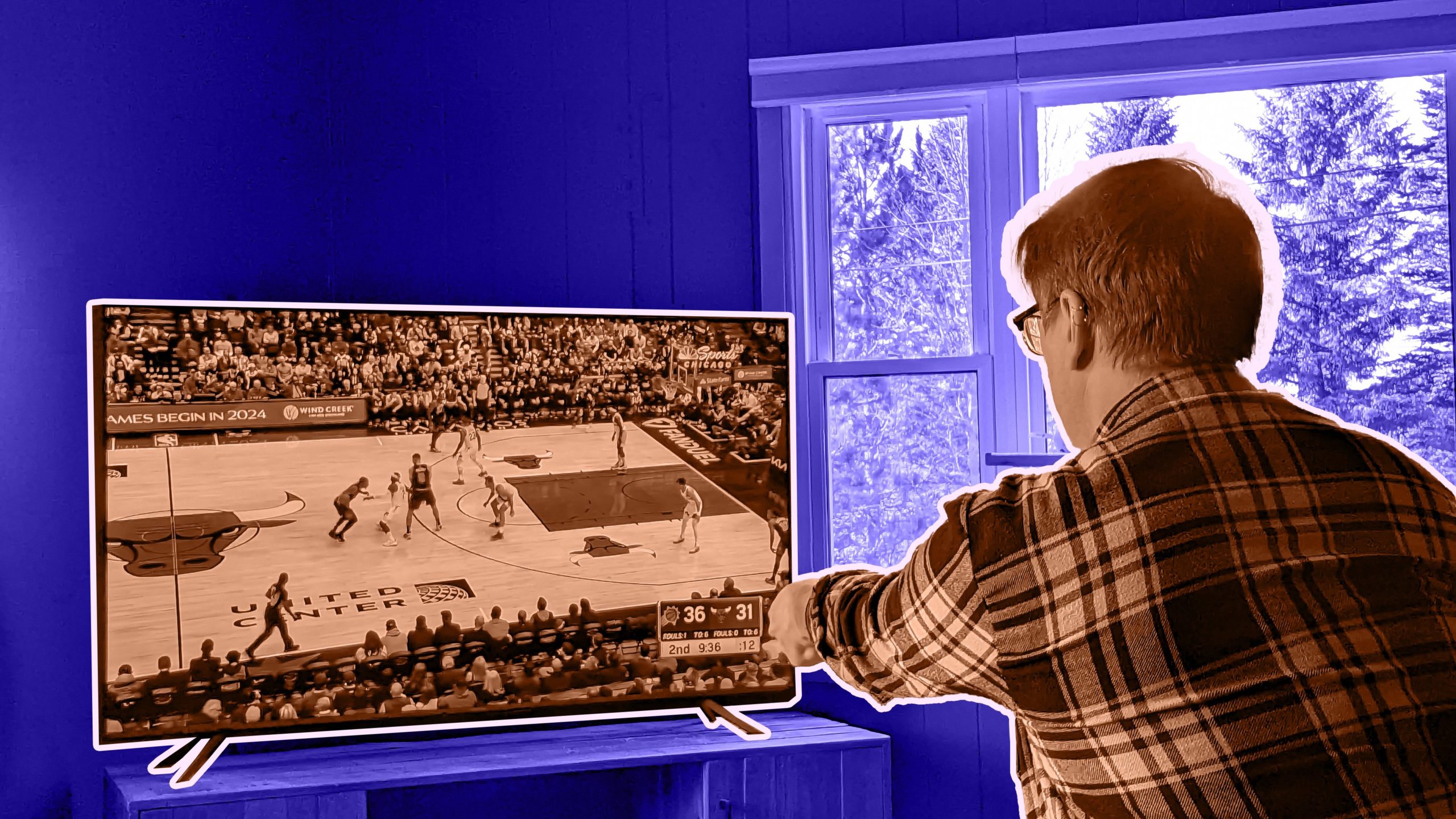 Man watching NBA on Sling Orange