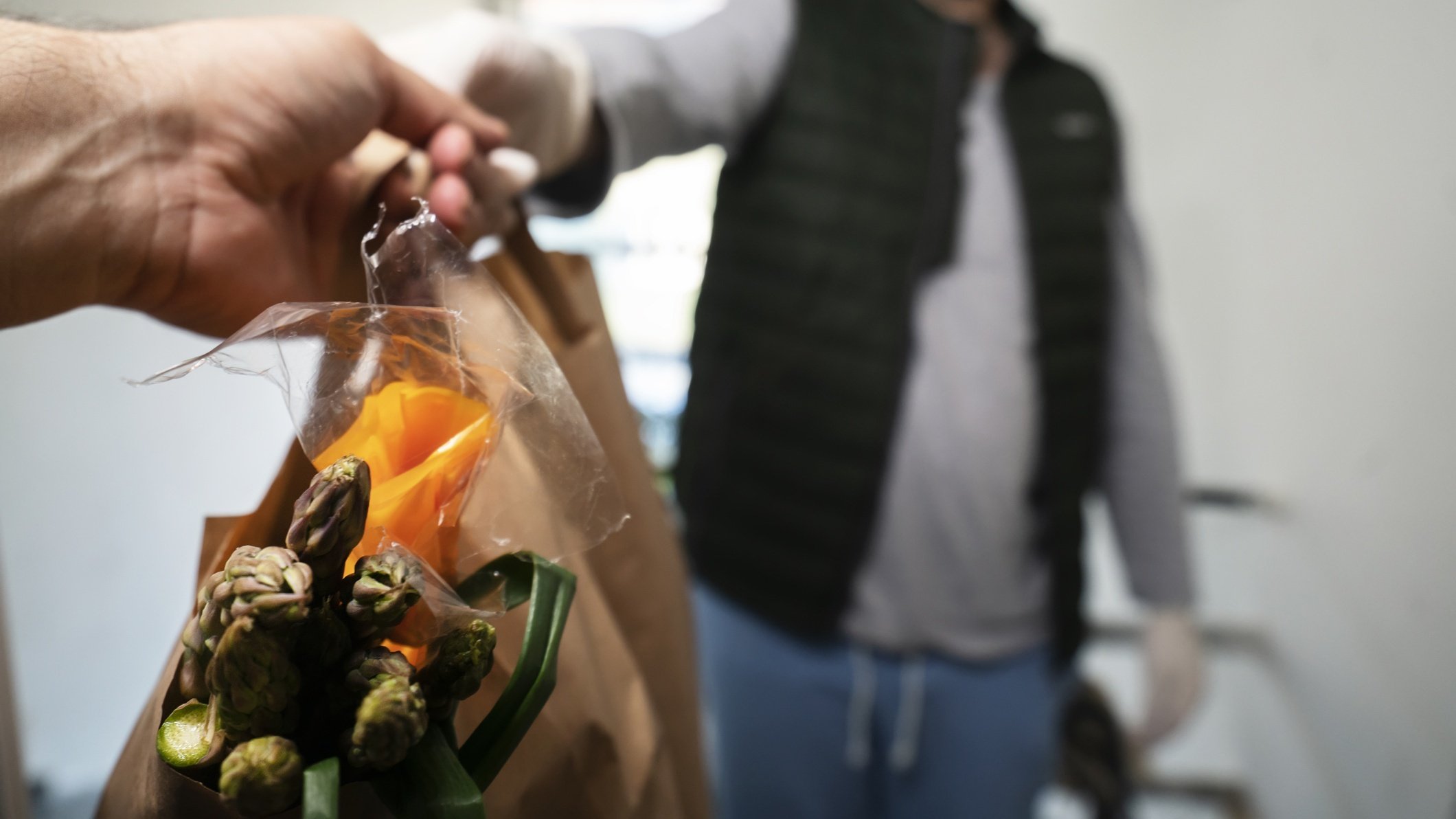 Man handing food to someone