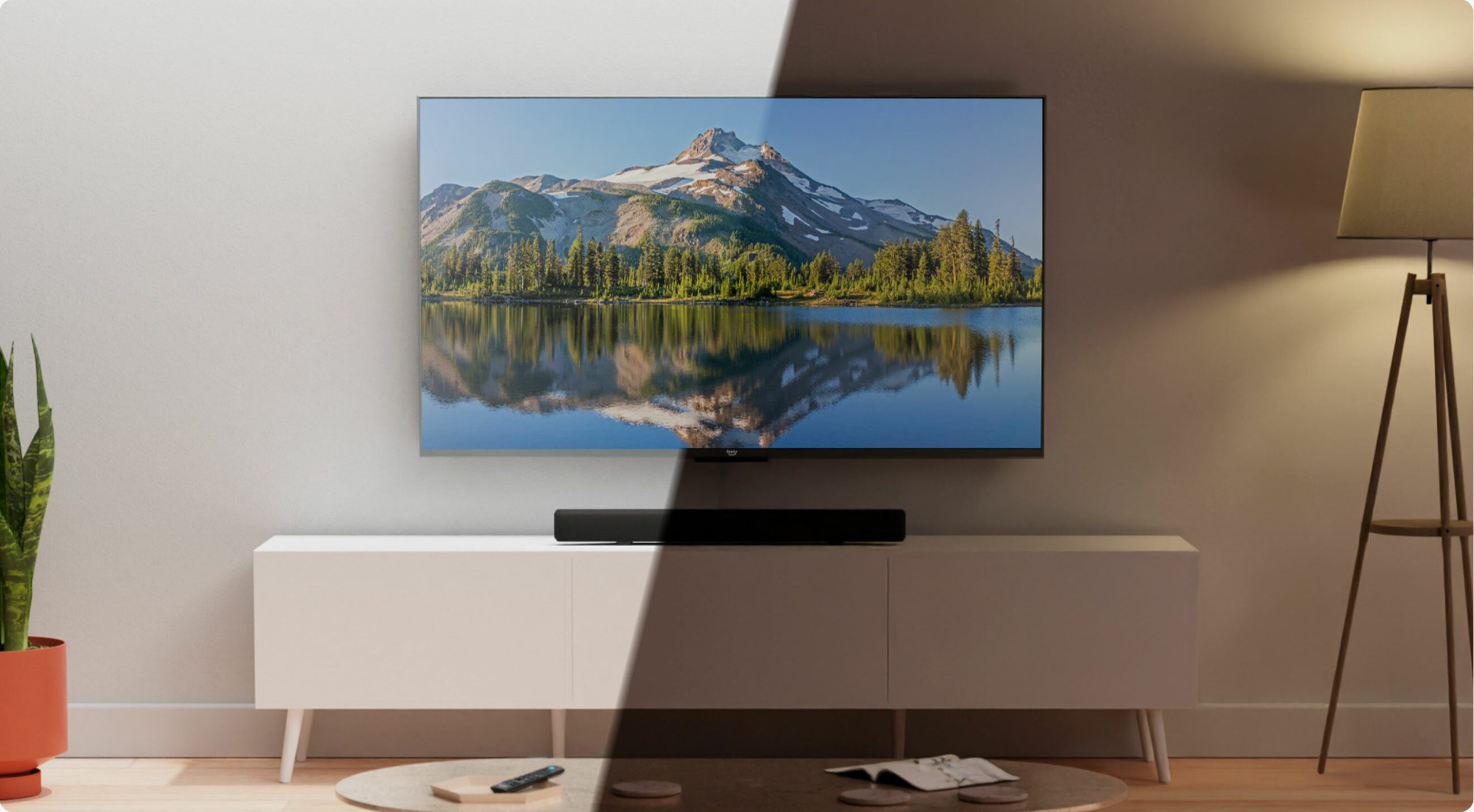 Amazon QLED TV on TV stand with light hitting half of the TV