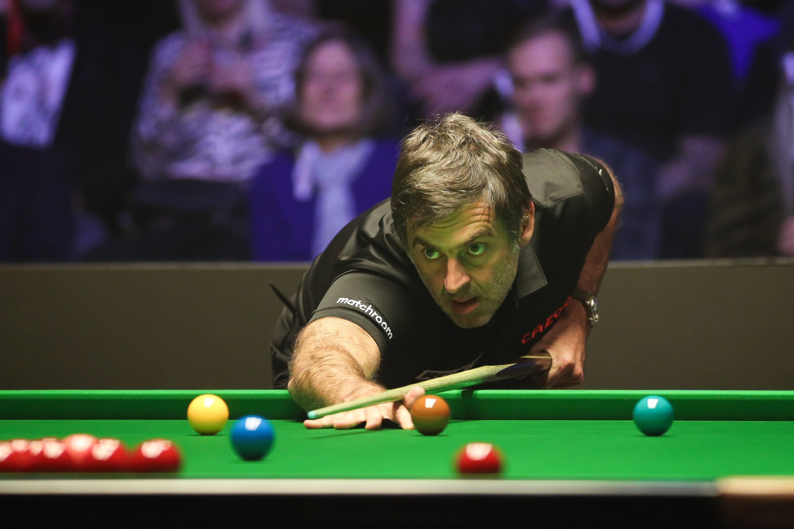 Ronnie O'Sullivan plays a shot