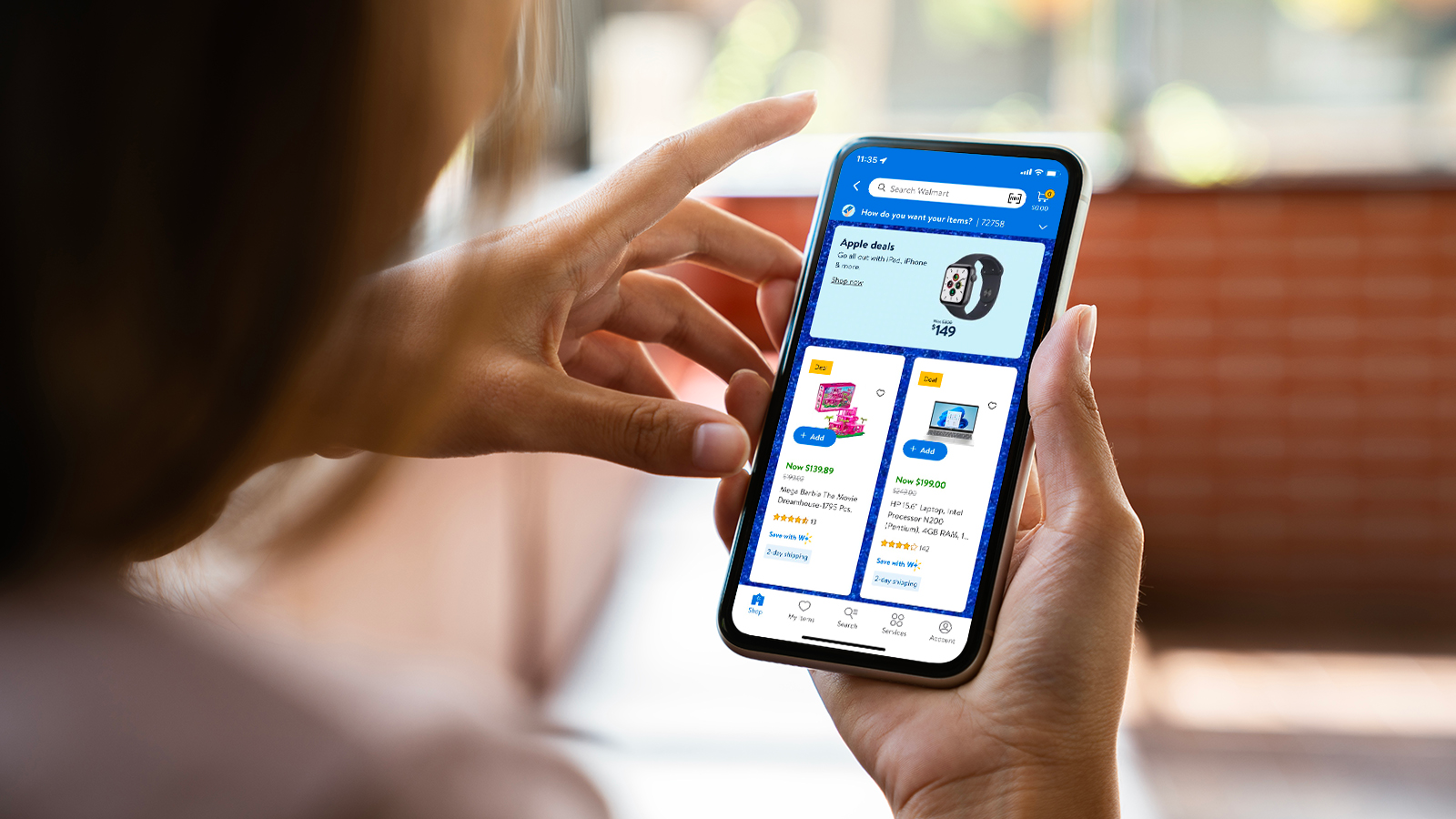 a close-up, over-the-shoulder view of a woman shopping for black friday deals on the walmart app