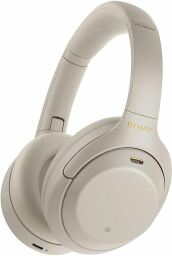 The Sony WH-1000XM4 over-ear headphones in a whitish color