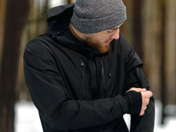 Man using heated jacket outdoors