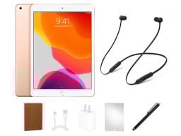 An iPad 7, Beats earbuds, stylus, charger, screen protector, and case.