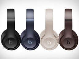 Line of four Beats Studio Pro headphones in a row