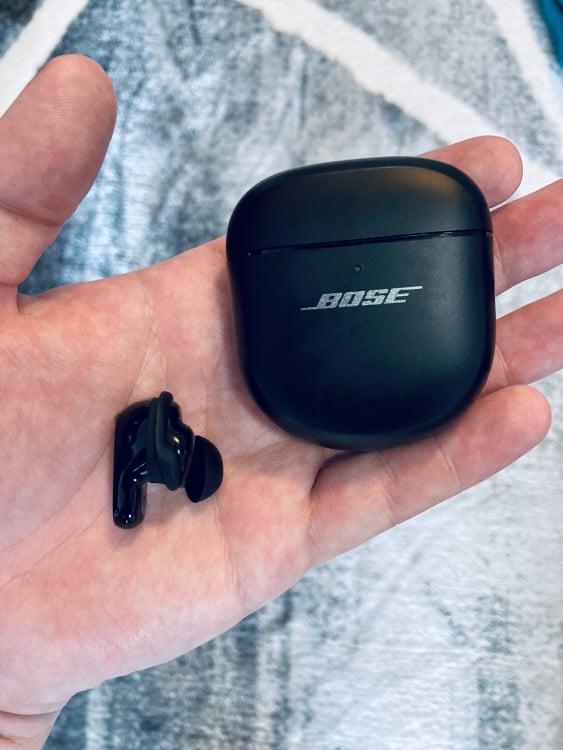 bose quietcomfort ultra earbuds in an open hand