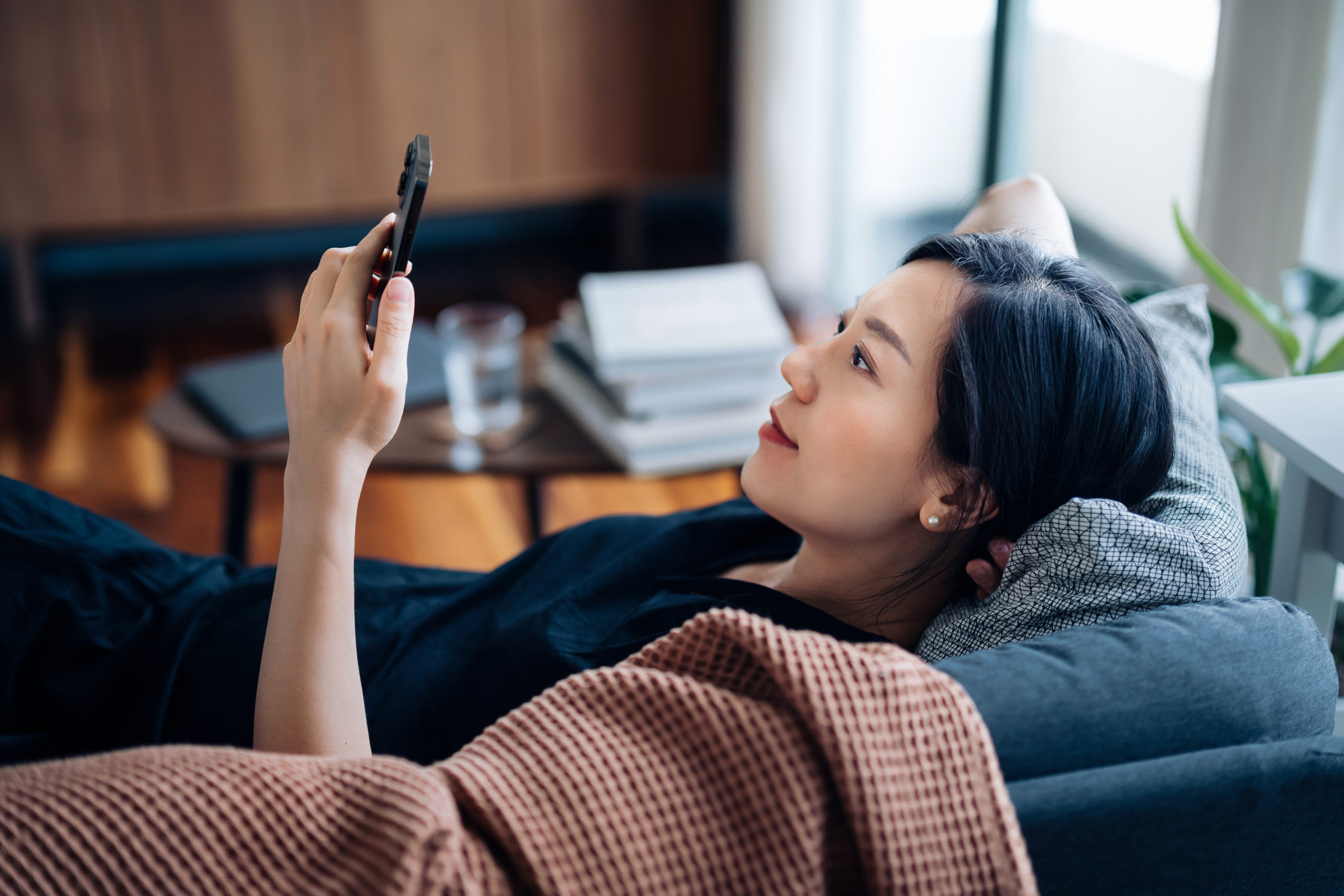 woman reading on her phone