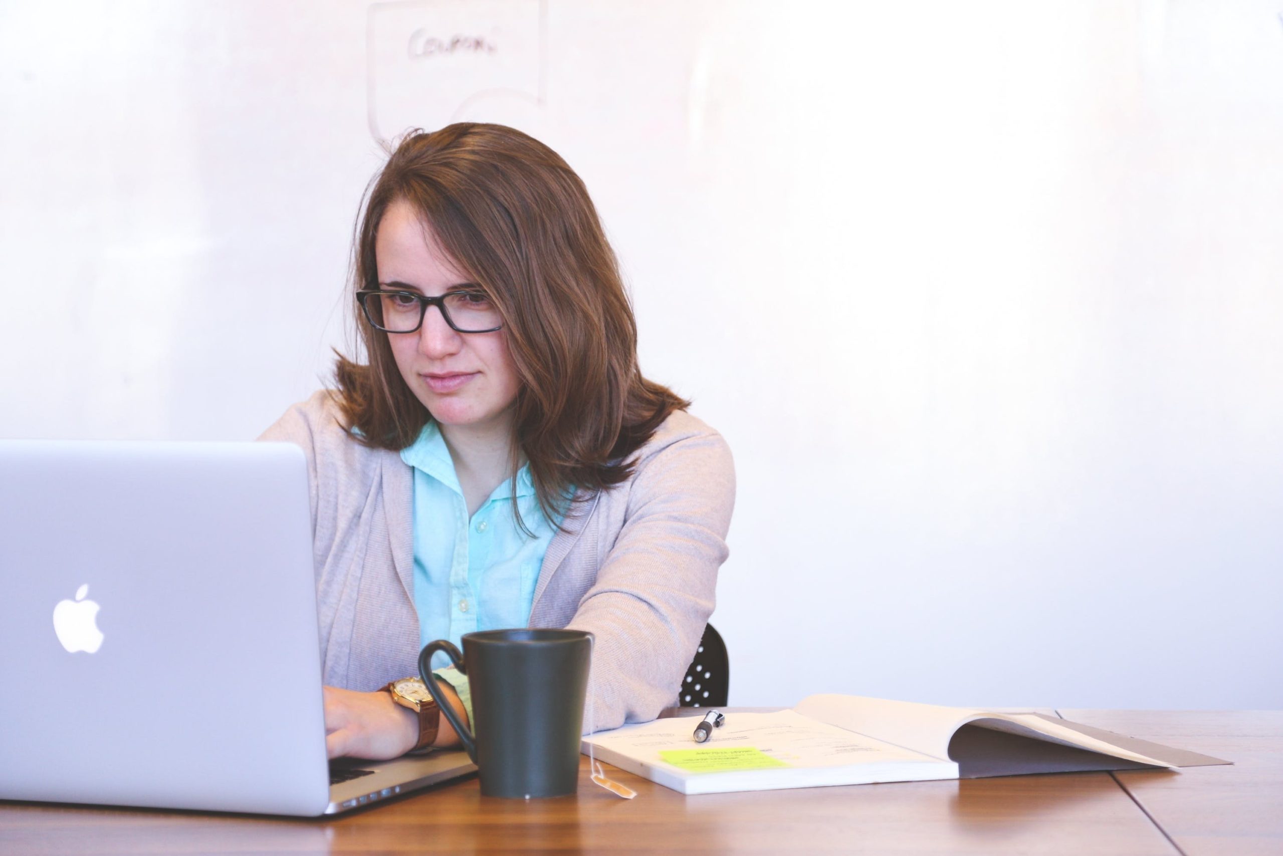 Woman looking at laptop