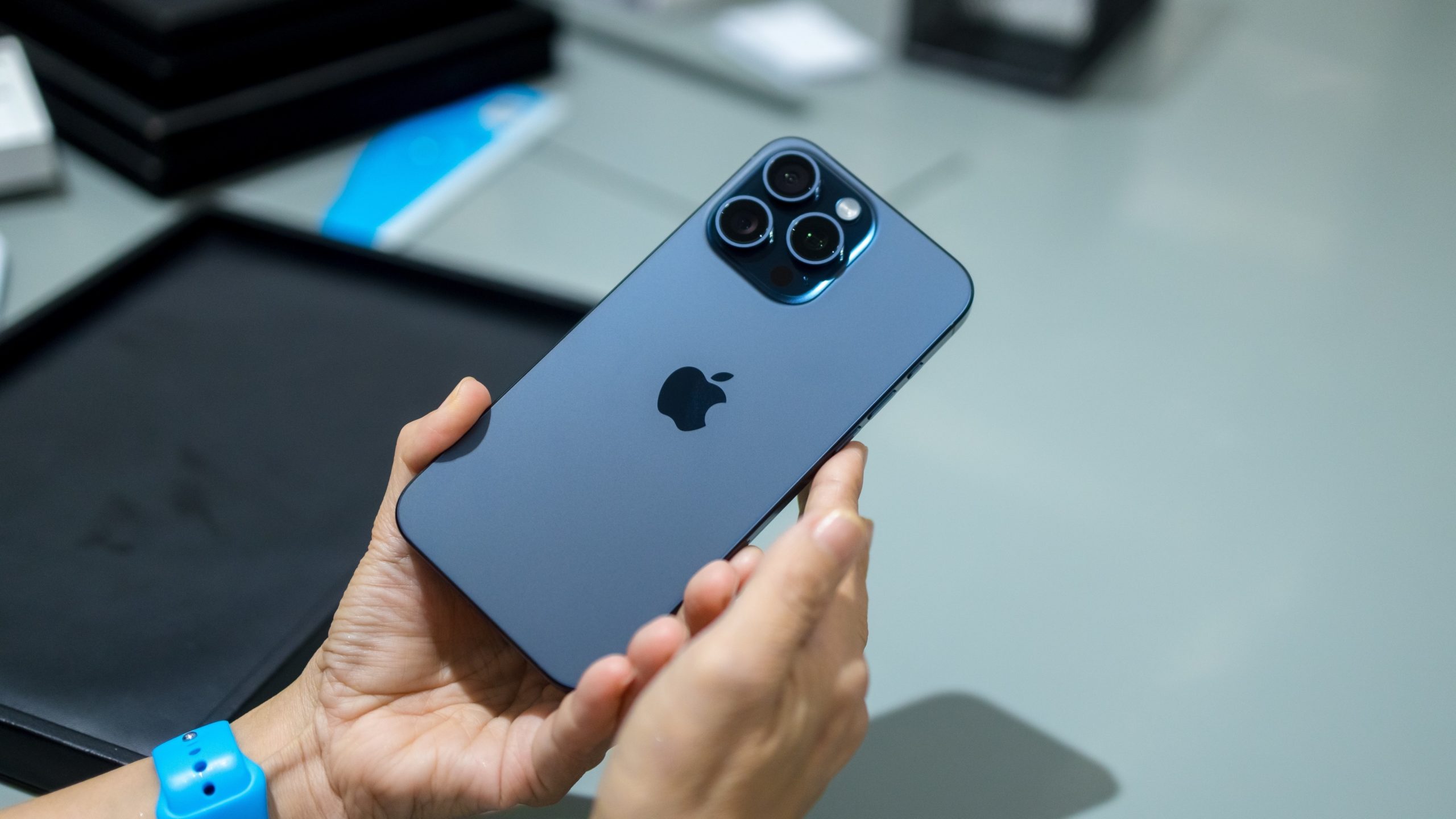 Man holding iPhone 15