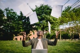 Man throwing CVs in air