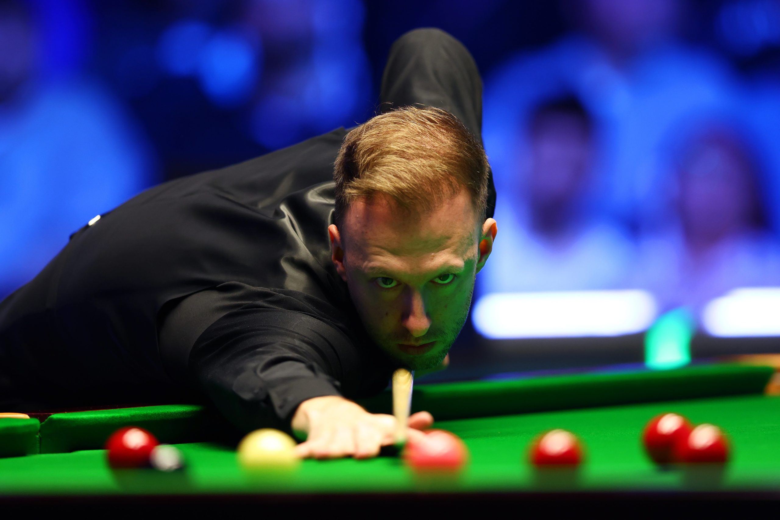 Judd Trump of England plays a shot