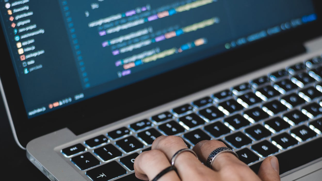 Hand on laptop