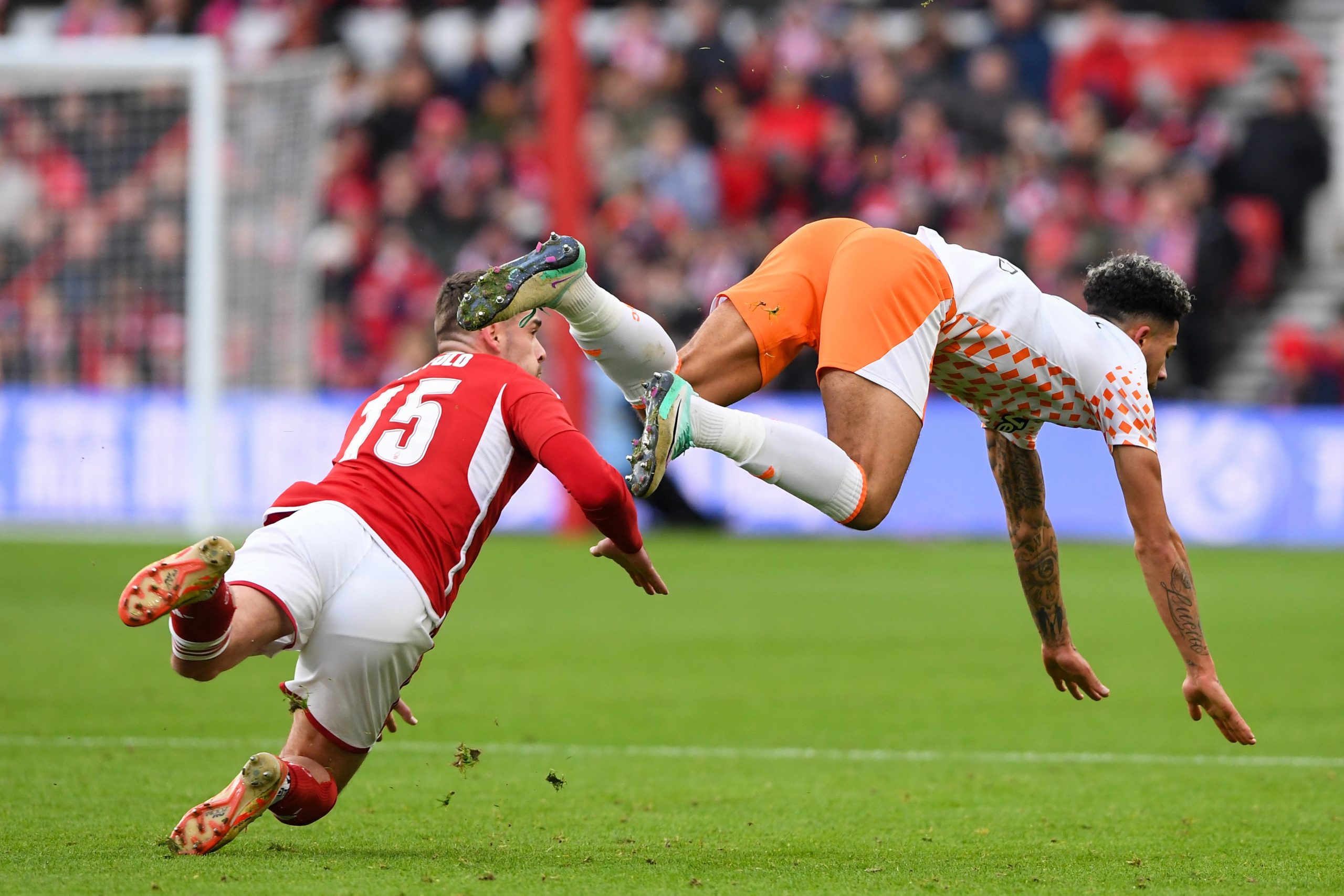 Harry Toffolo of Nottingham Forest is battling with Jordan Gabriel of Blackpool