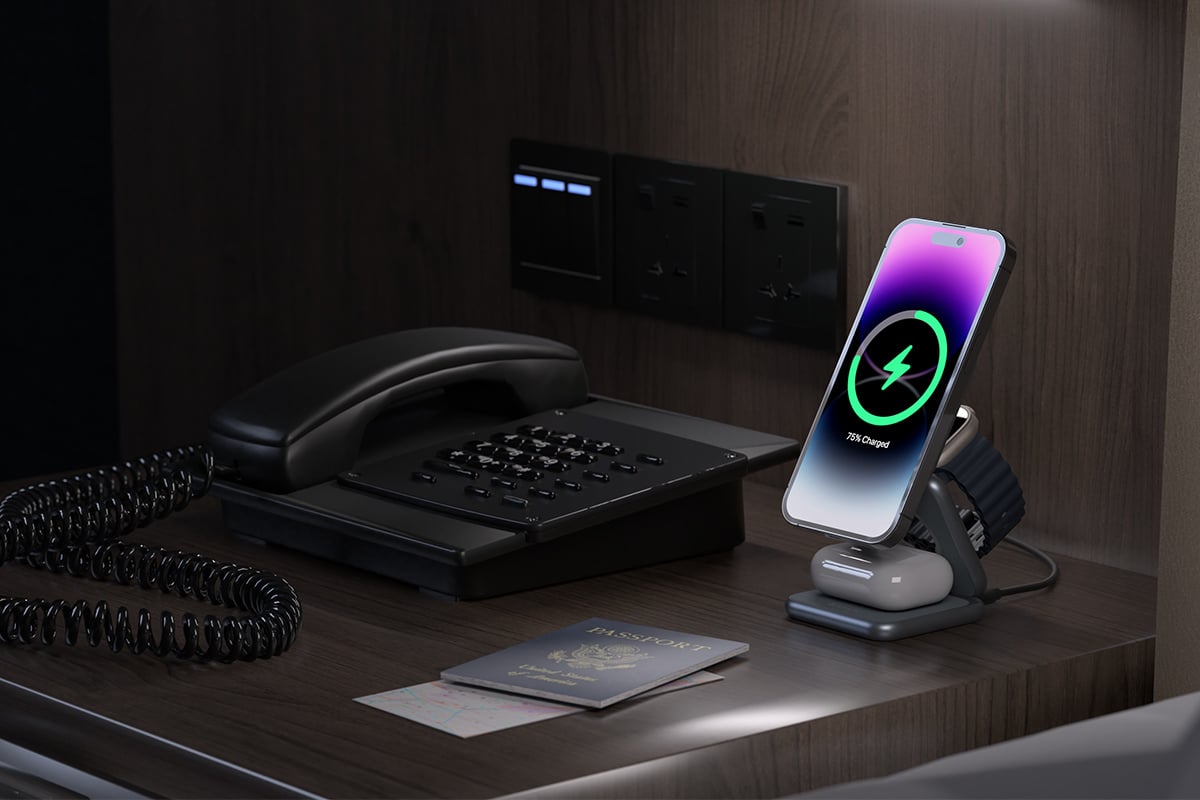 desk setup with smartphone on charger 