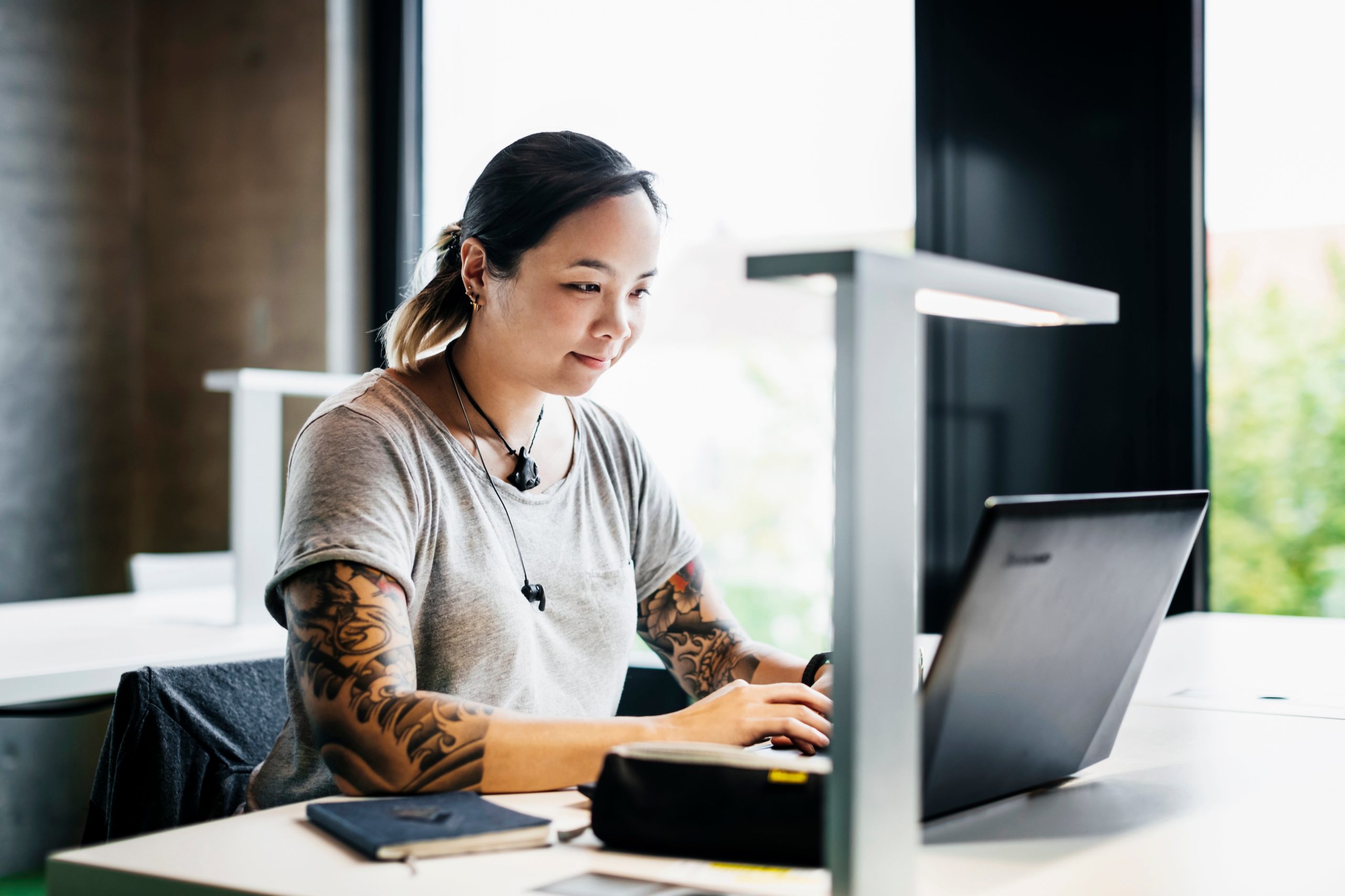 woman typing on laptop