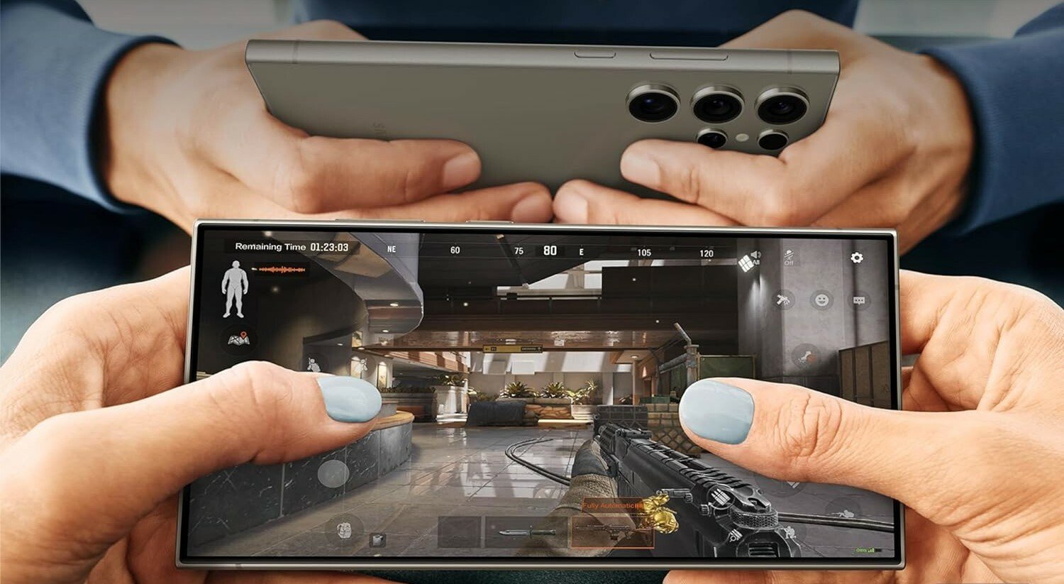 a person holds the samsung galaxy s24 ultra while playing a mobile game