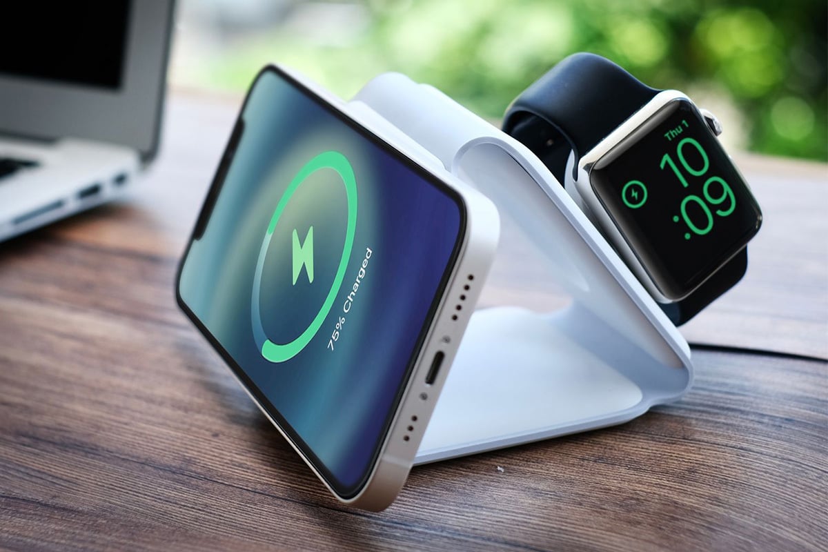 smartphone and Apple Watch on folded charger stand
