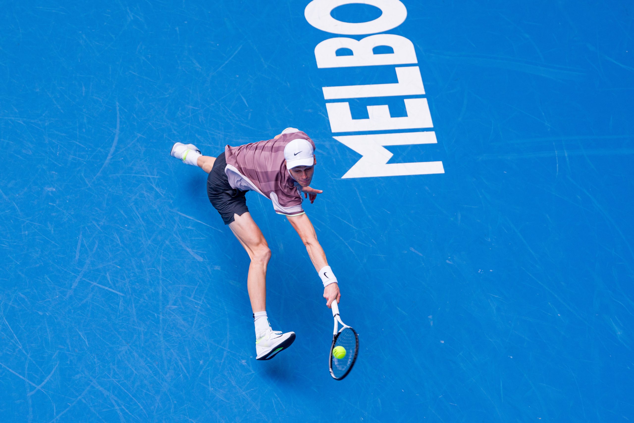 Jannik Sinner of Italy lunges