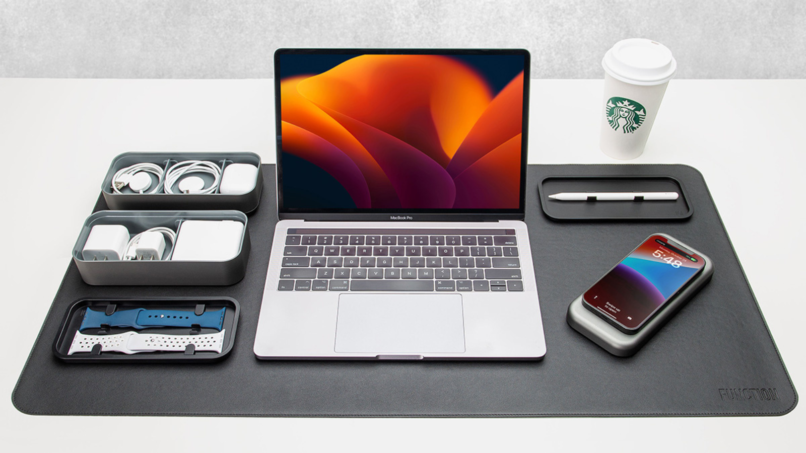 laptop on desk pad with bento stack 8000 and other accessories