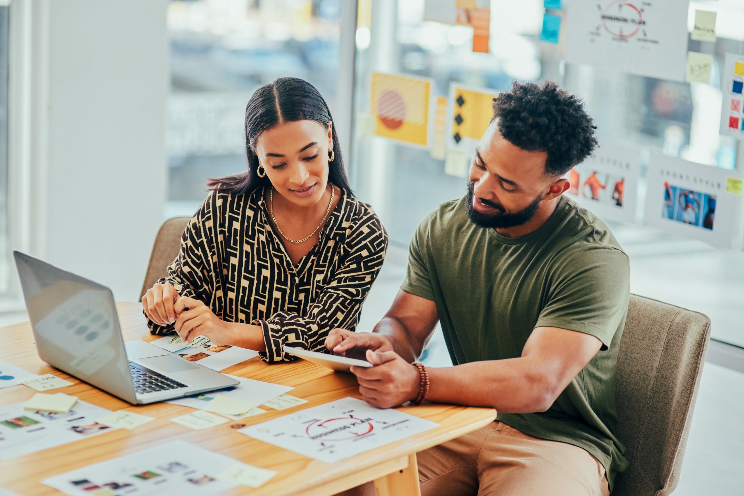 two people working together in an office