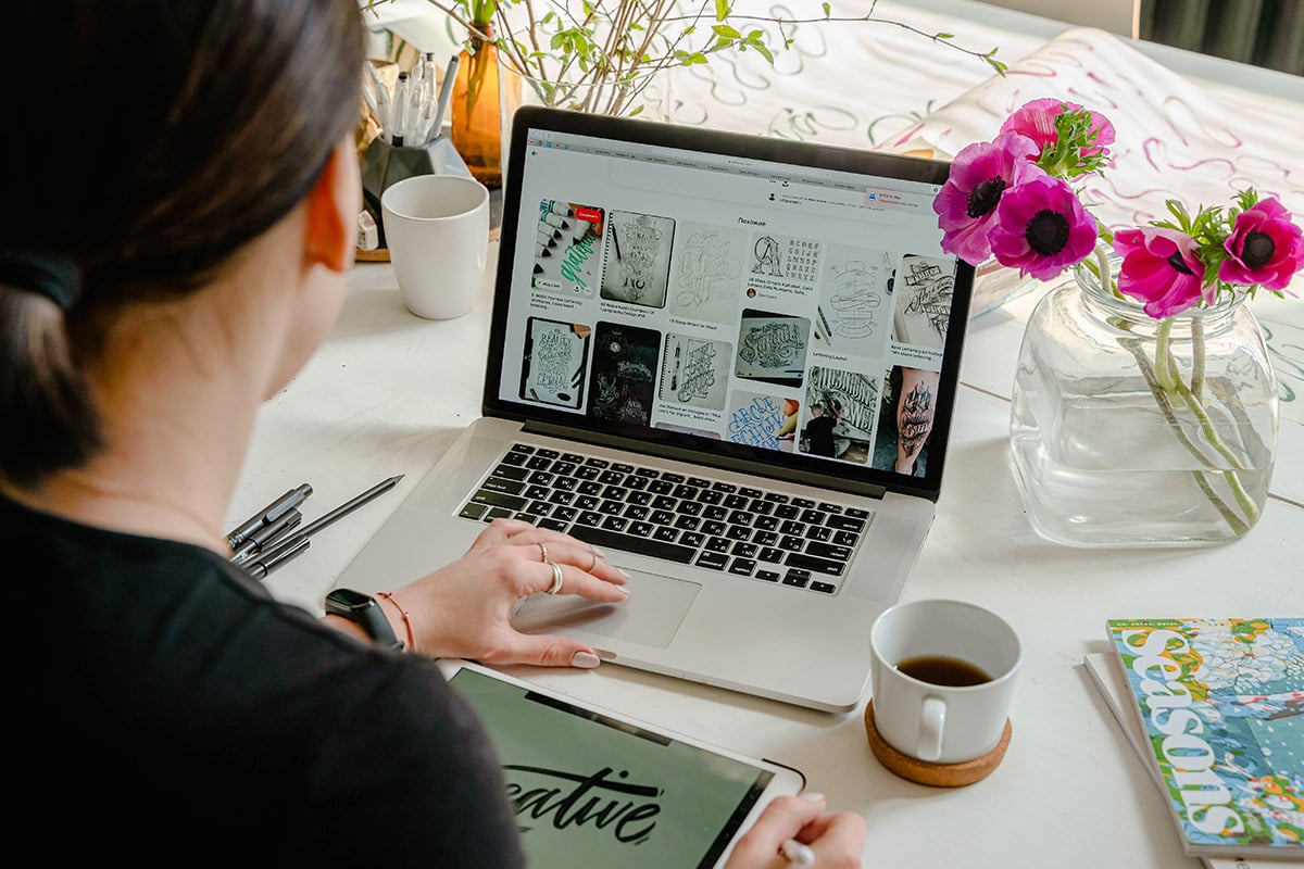 person using WordPress on a laptop