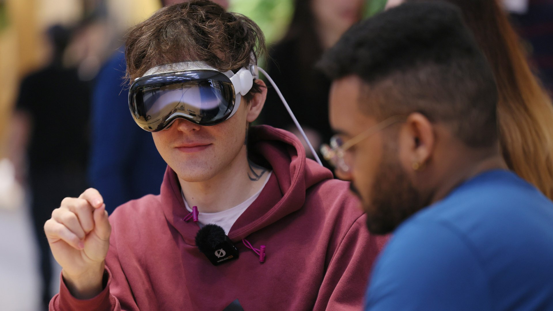 A person tries the Apple Vision Pro in an Apple store.
