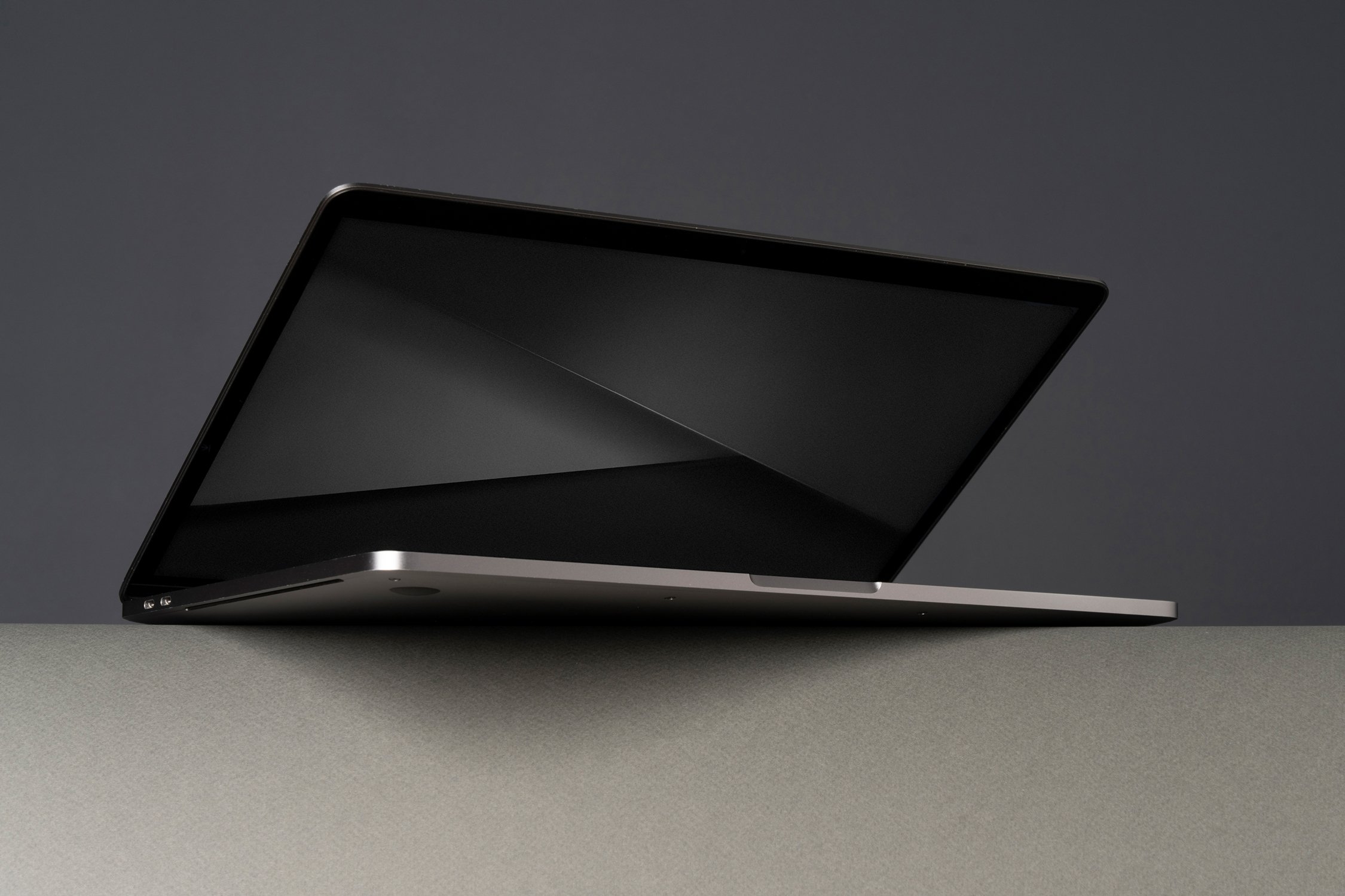Apple MacBook Pro on shelf