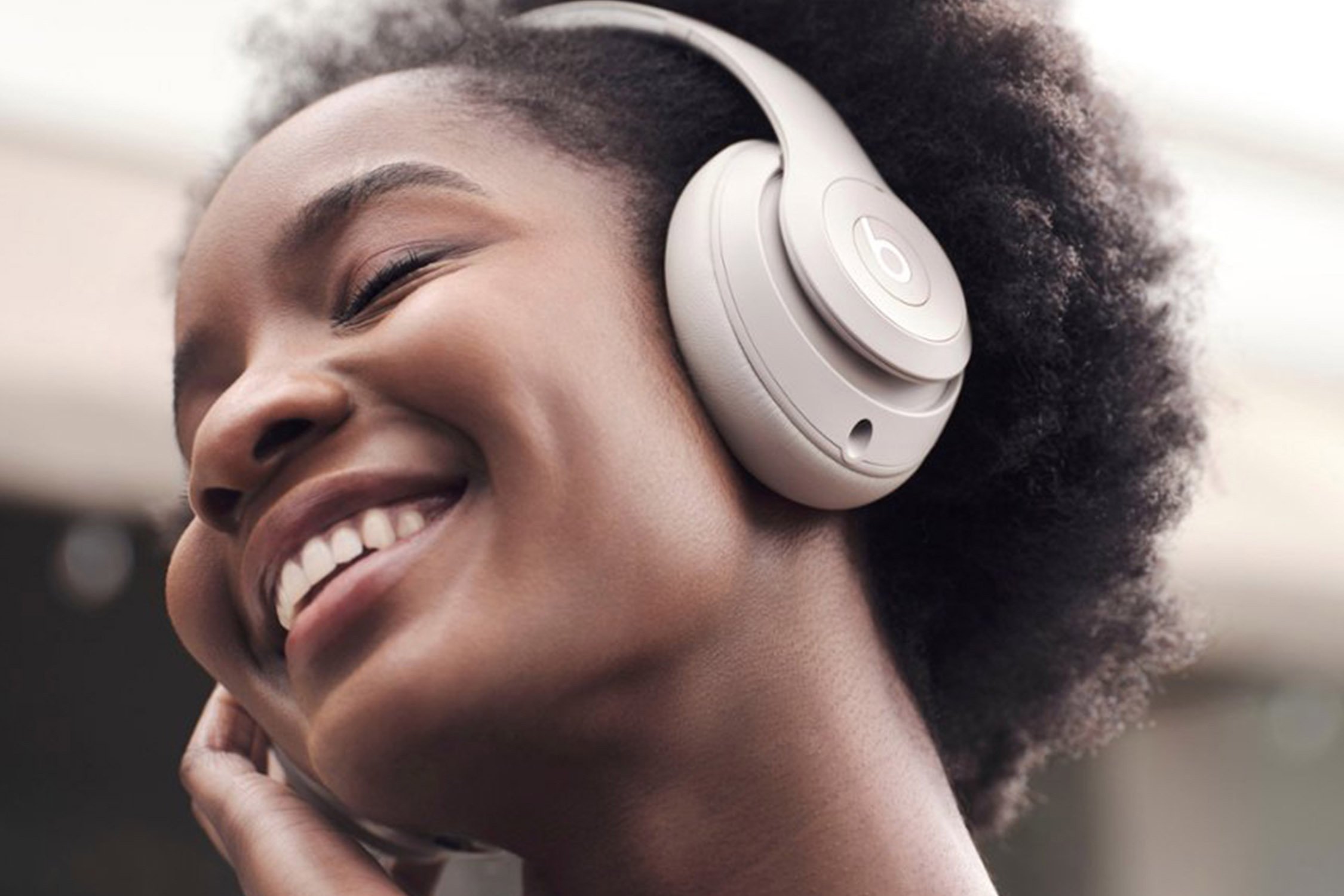 woman listening to music with Beats headphones