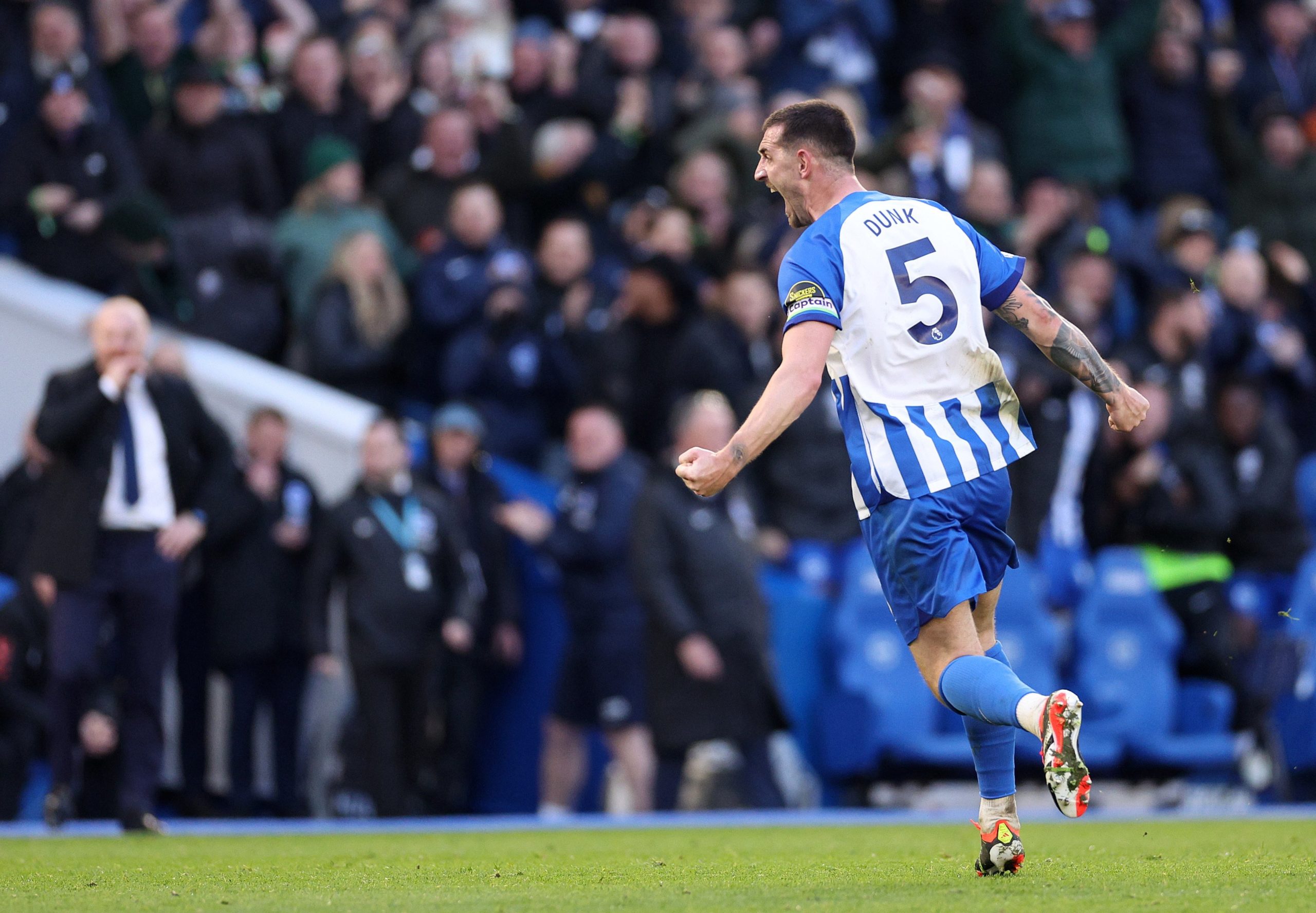 Lewis Dunk of Brighton celebrates scoring his team's first goal