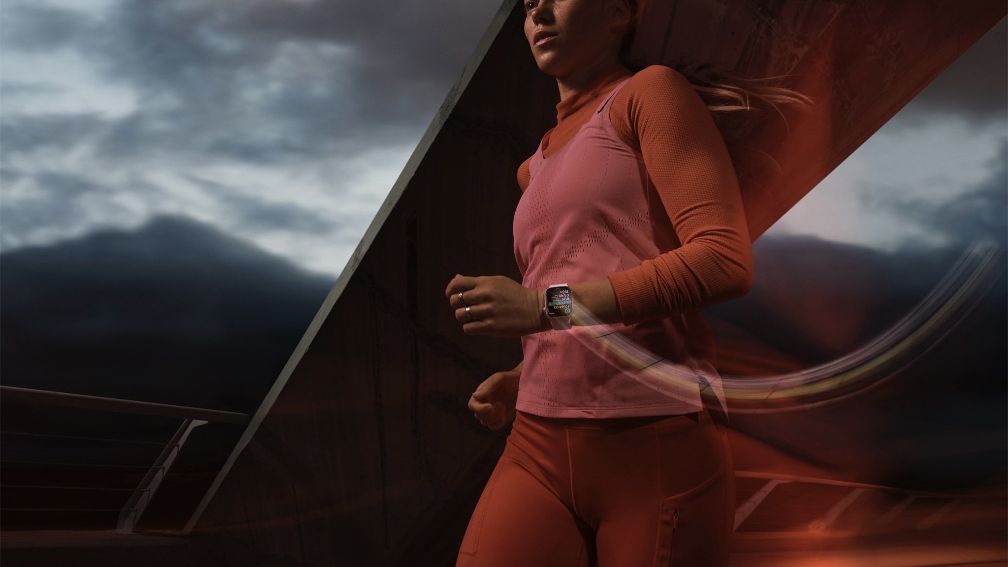 person running while wearing the pink apple watch series 9