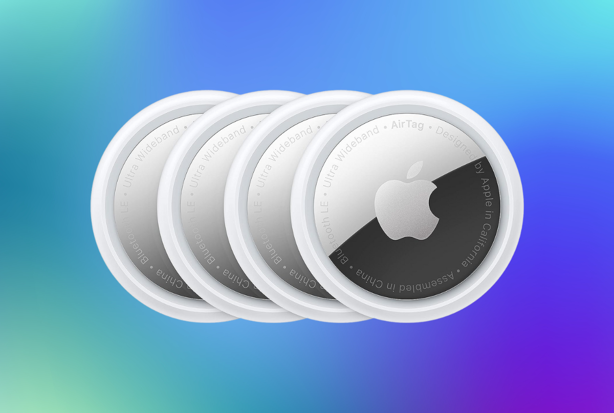 four pack of apple air tags against a blue background