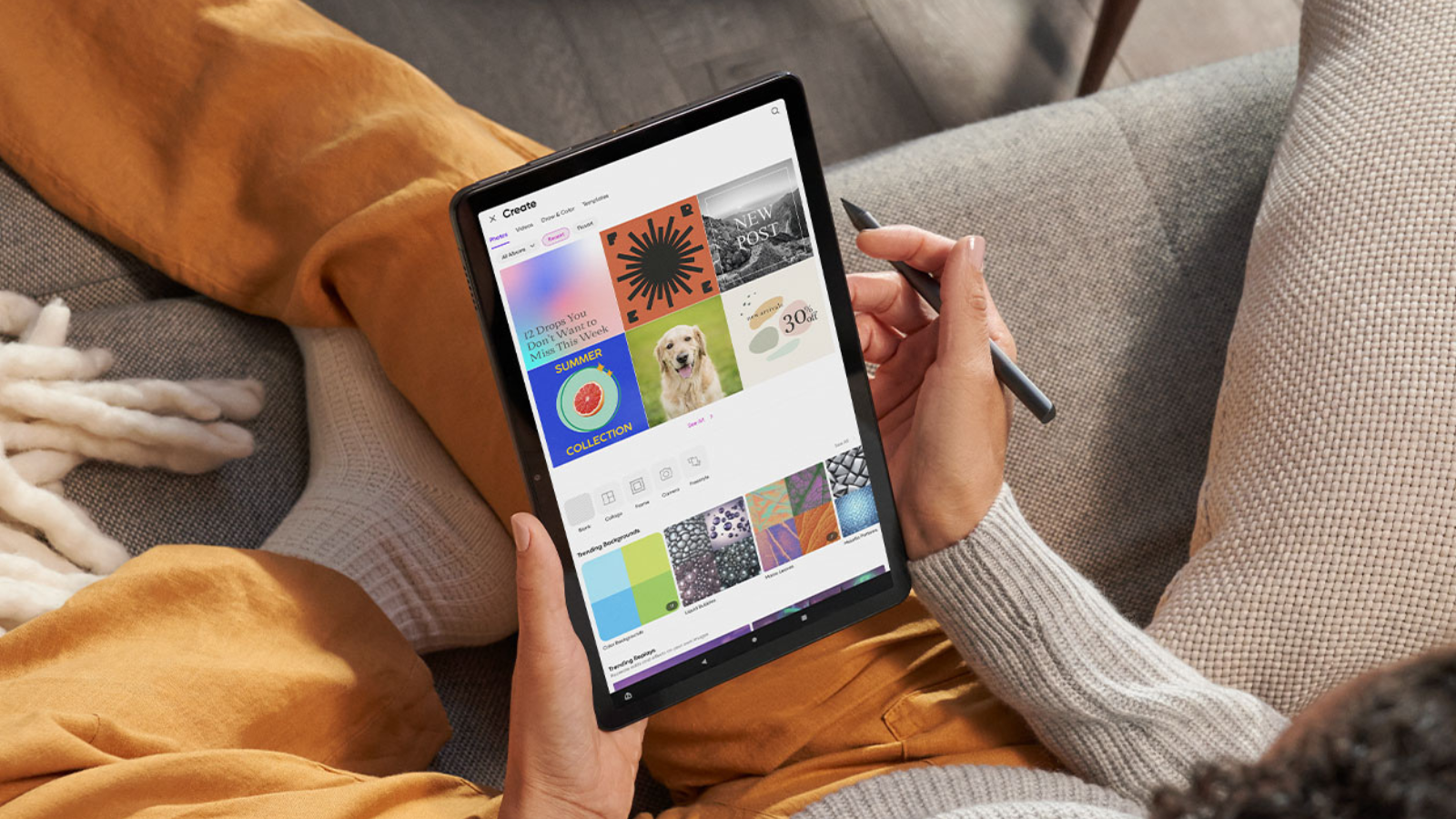 woman using Amazon Fire Max 11 tablet while sitting on couch