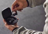 person taking Beats Powerbeats Pro out of charging case