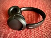 The Sony WH-CH520 headphones laying on red carpeting