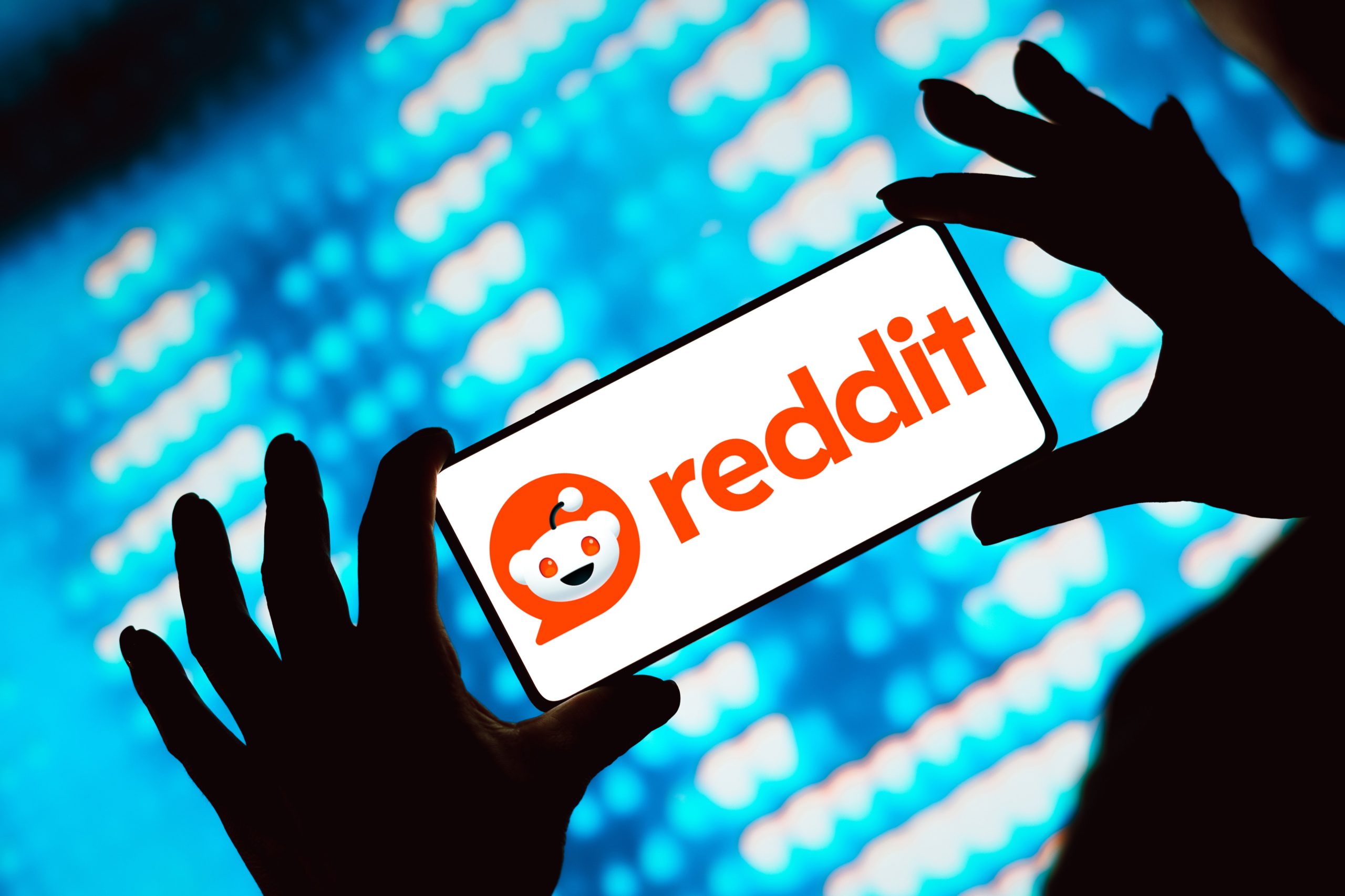 Reddit logo displayed on a smartphone