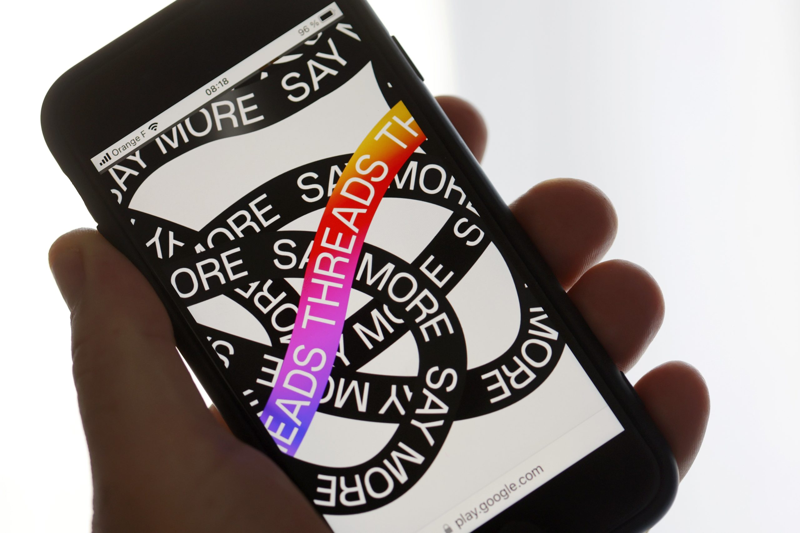 A phone displaying the Threads app.