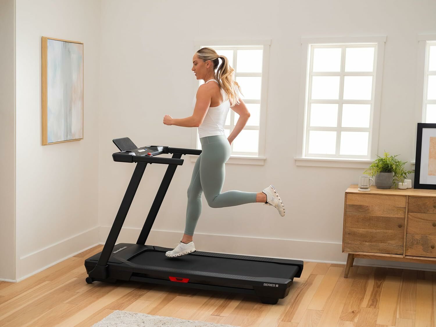 Girl runs on treadmill