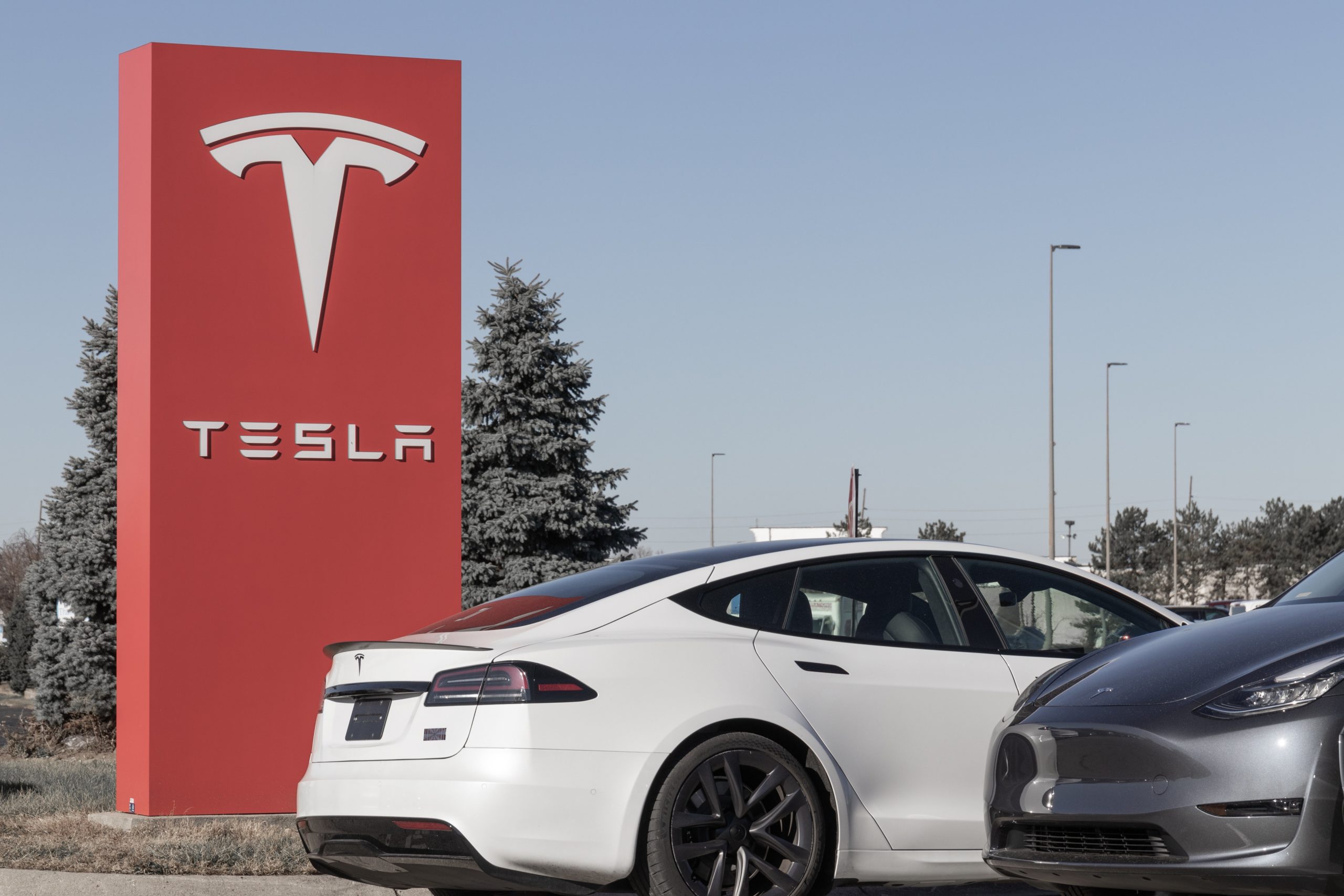 Tesla EV electric vehicles on display. Tesla products include electric cars, battery energy storage and solar panels.