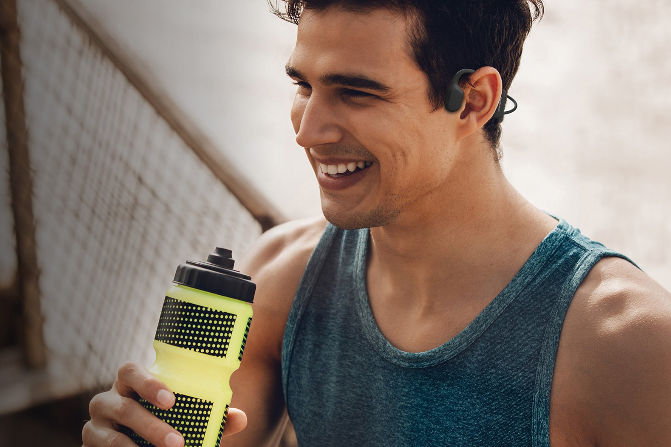 Man using ope-ear headphones while working out.