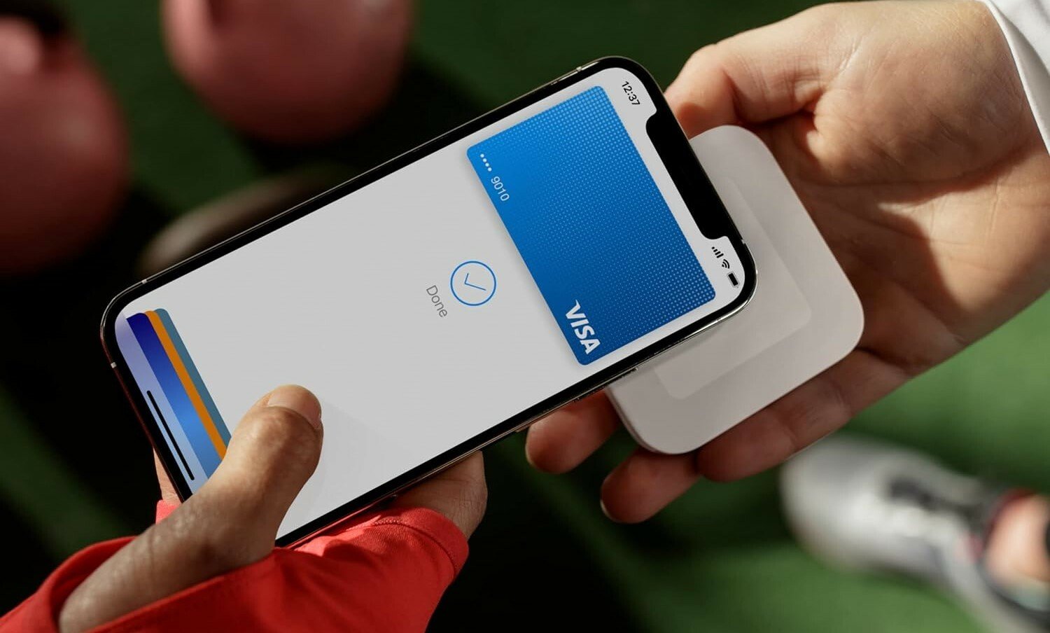 a person pays for a transaction with their cell phone and a square reader