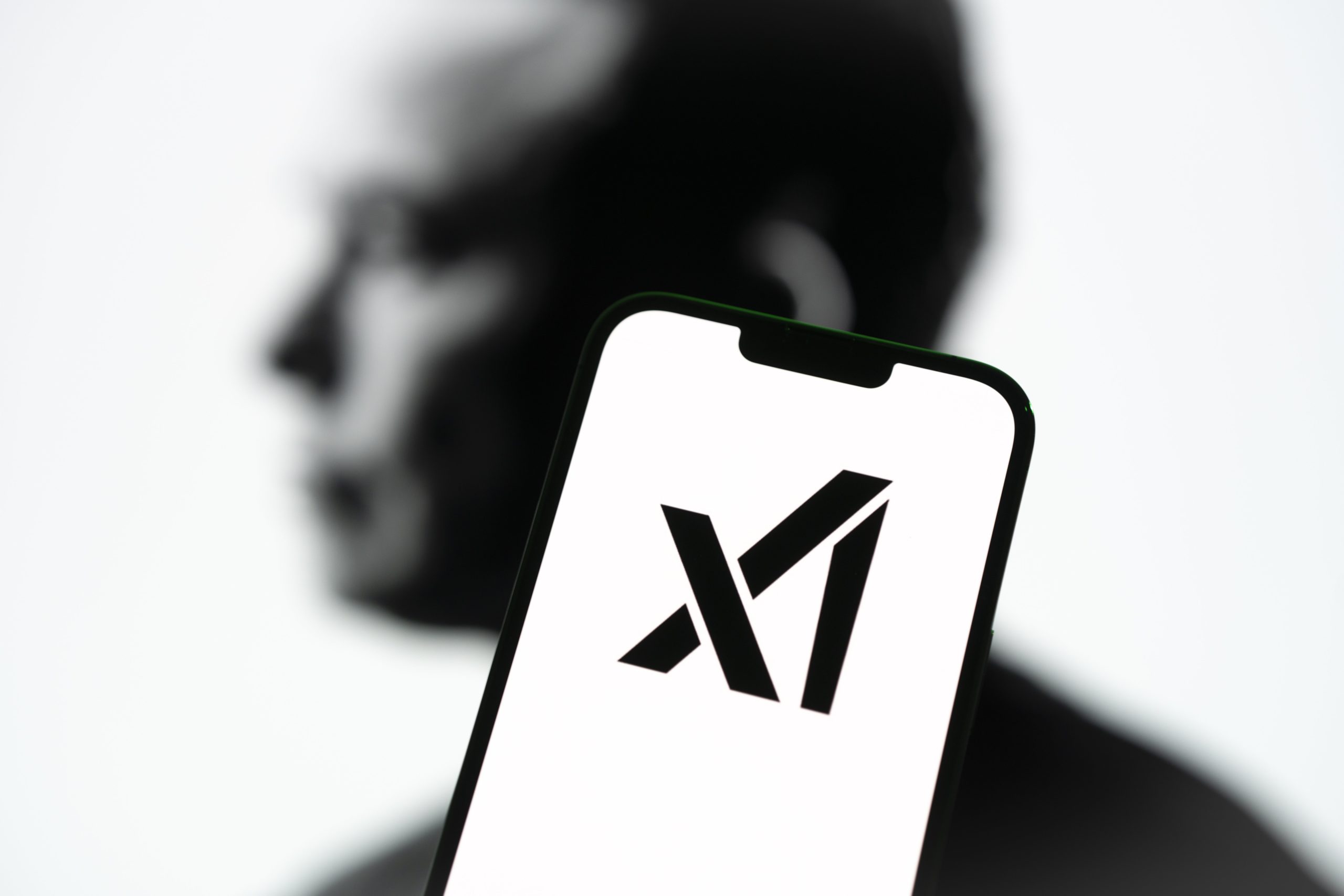 Elon Musk and xAI logo