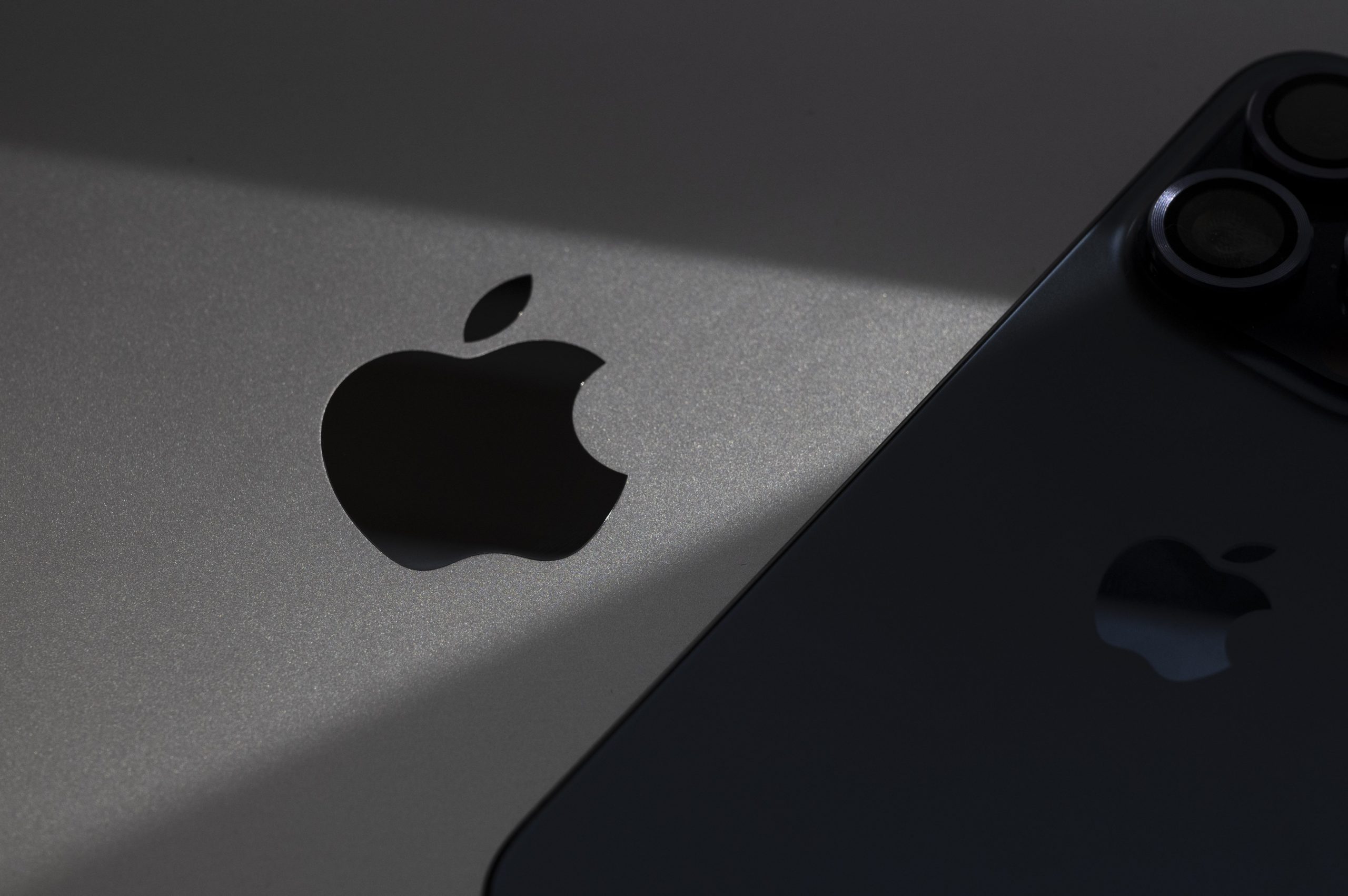 apple logo on computer and phone