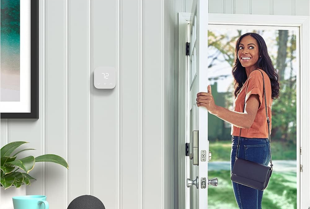 Amazon smart thermostat on a gray wall