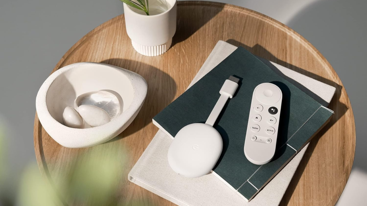 google chromecast device sitting on stack of books