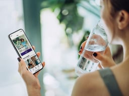 Woman using health app on phone.