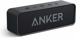 a black anker soundcore speaker on a white background