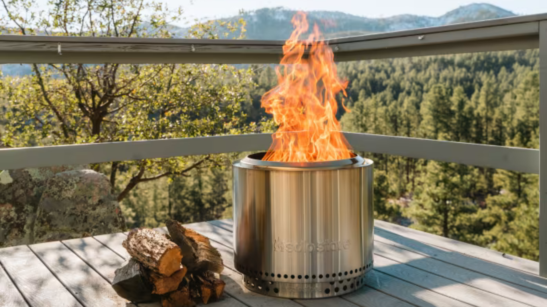 A Solo Bonfire fire put on a deck against the skyline.