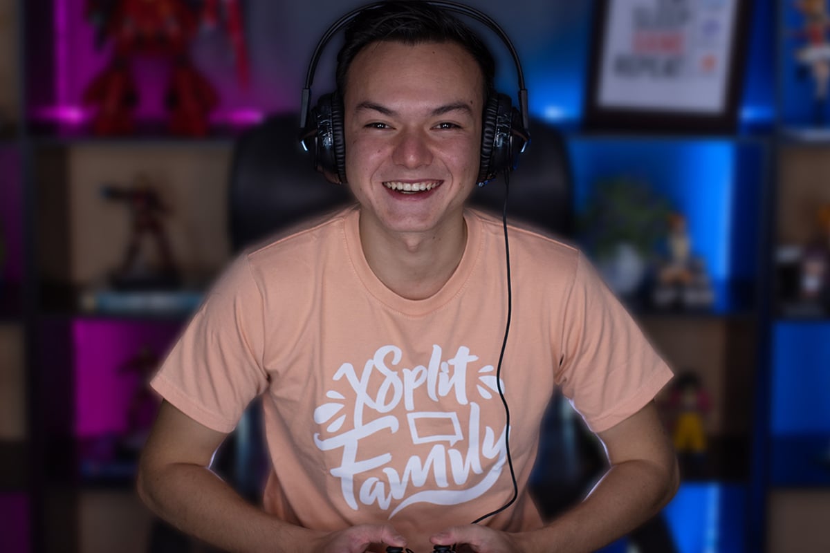 Young man streaming himself playing video games