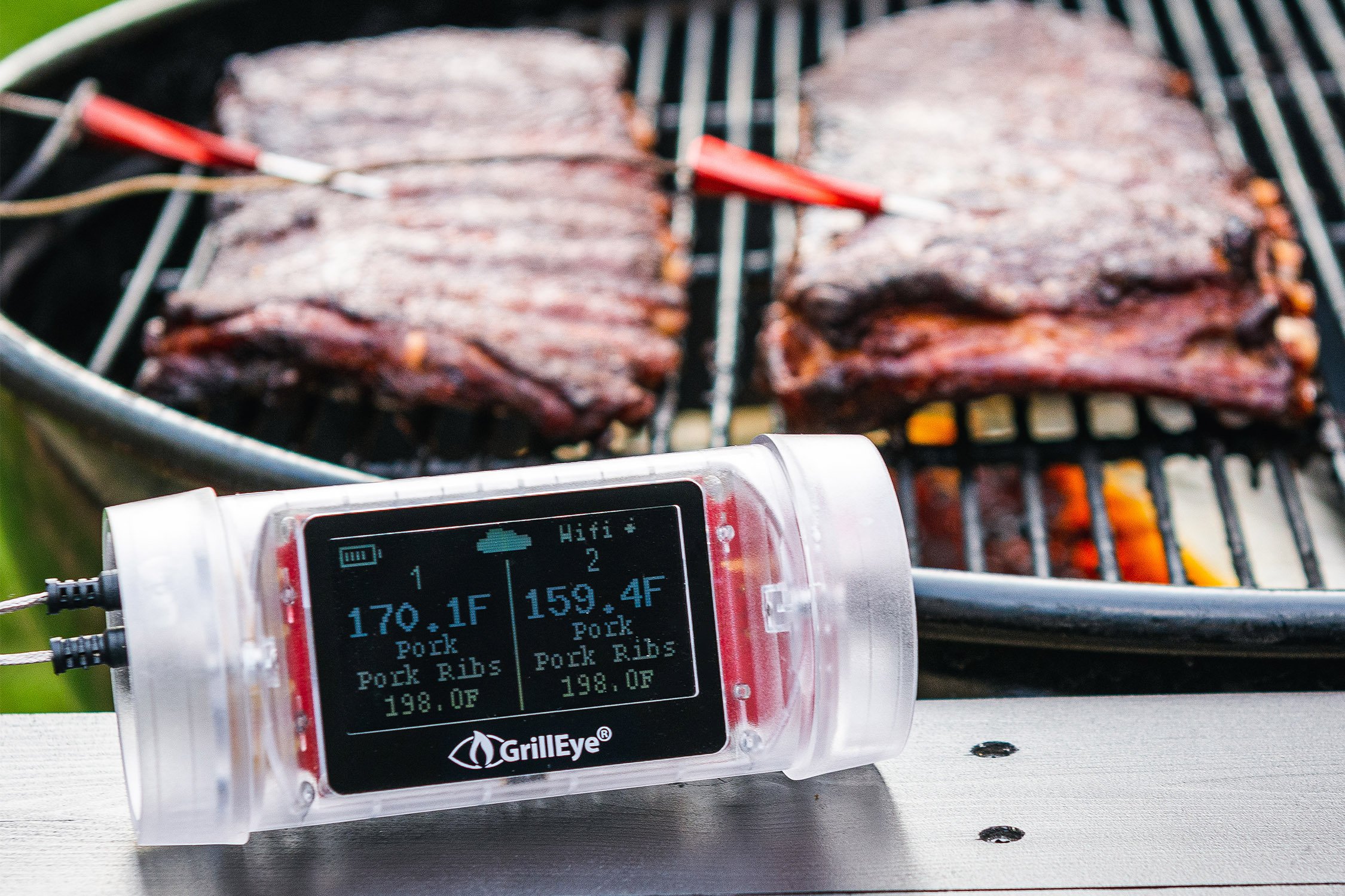 Meat temperatures being displayed on thermometer.
