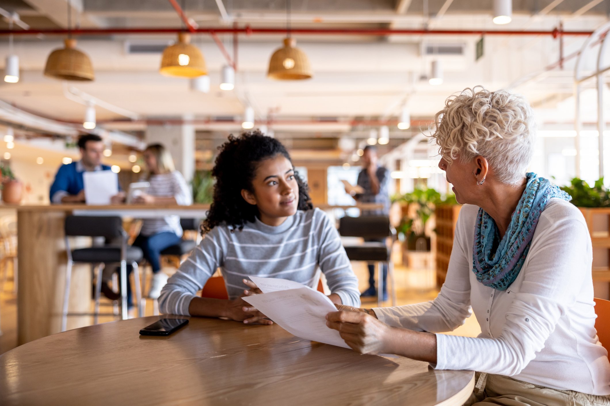 young woman being interviewed by older woman for job